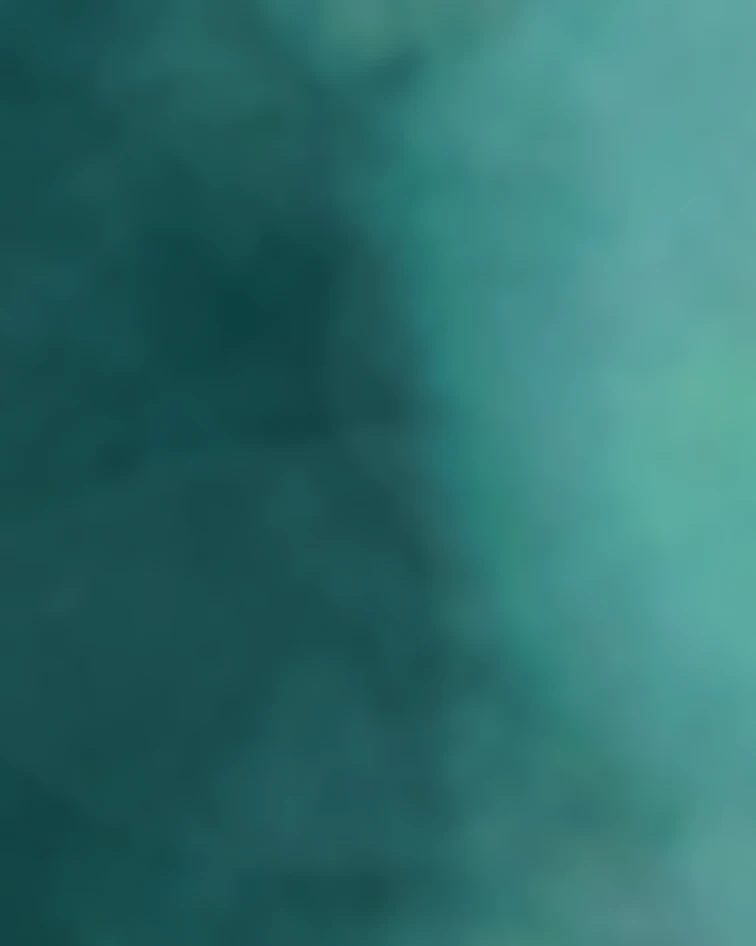 Blurred gradient background with dark teal on the left fading to lighter teal on the right.