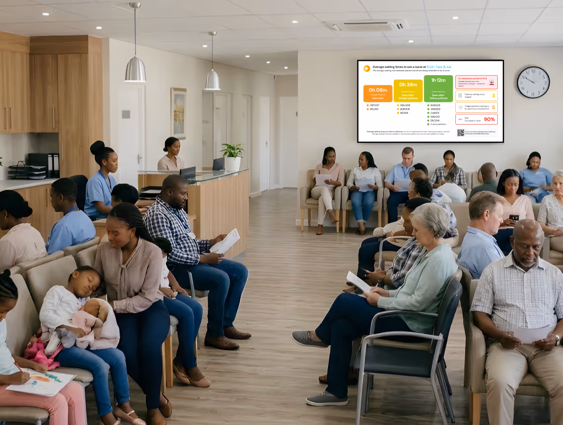Diverse group of people seated in a medical waiting room, many reading or using phones.