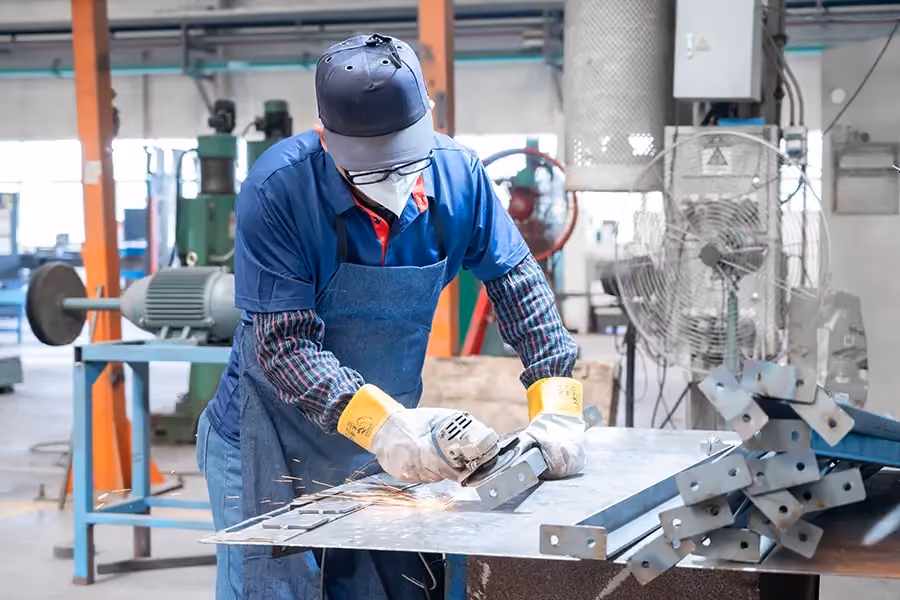 NewBeacon's food trailer manufacturing process: Precision grinding removes sharp edges and weld seams, creating smooth surfaces ready for flawless finishing.