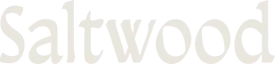 Saltwood wordmark logo in a serif font with light beige color.