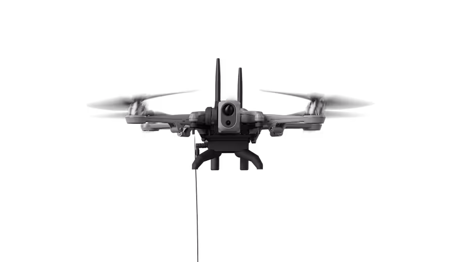 Black quadcopter drone with extended landing legs and a camera mounted underneath.