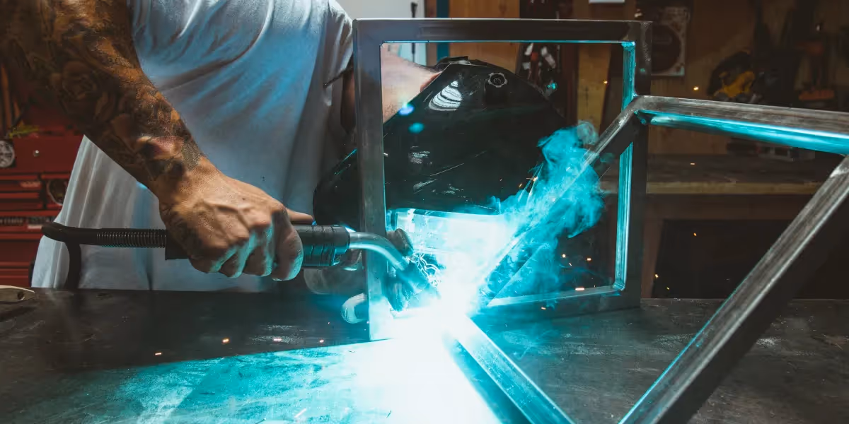 Blue-green sparks flying from metal