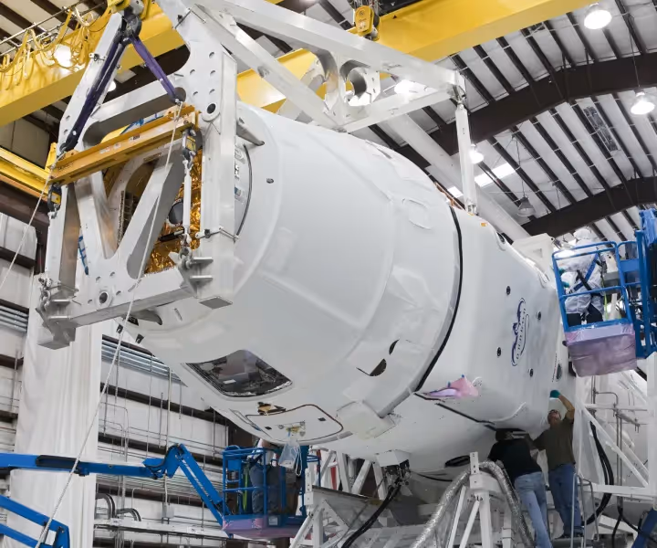 Workers assembling Space X capsule