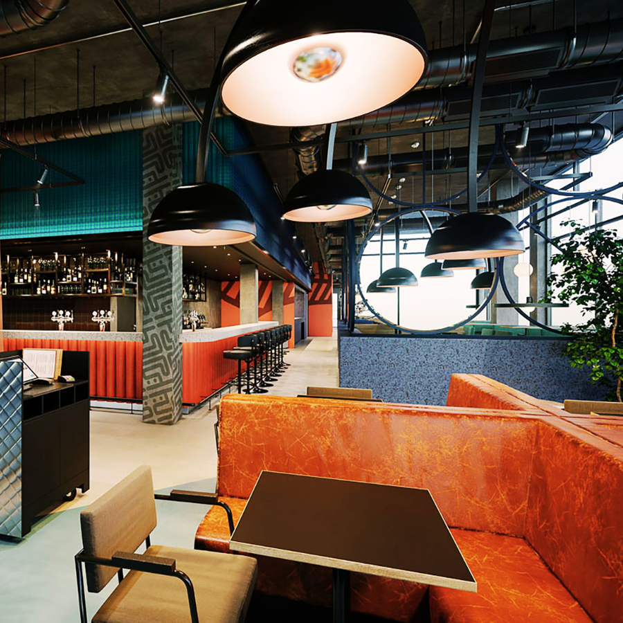 A picture of two smiling women in the audience raising their hands.