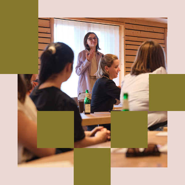A person talking to the group in a workshop.