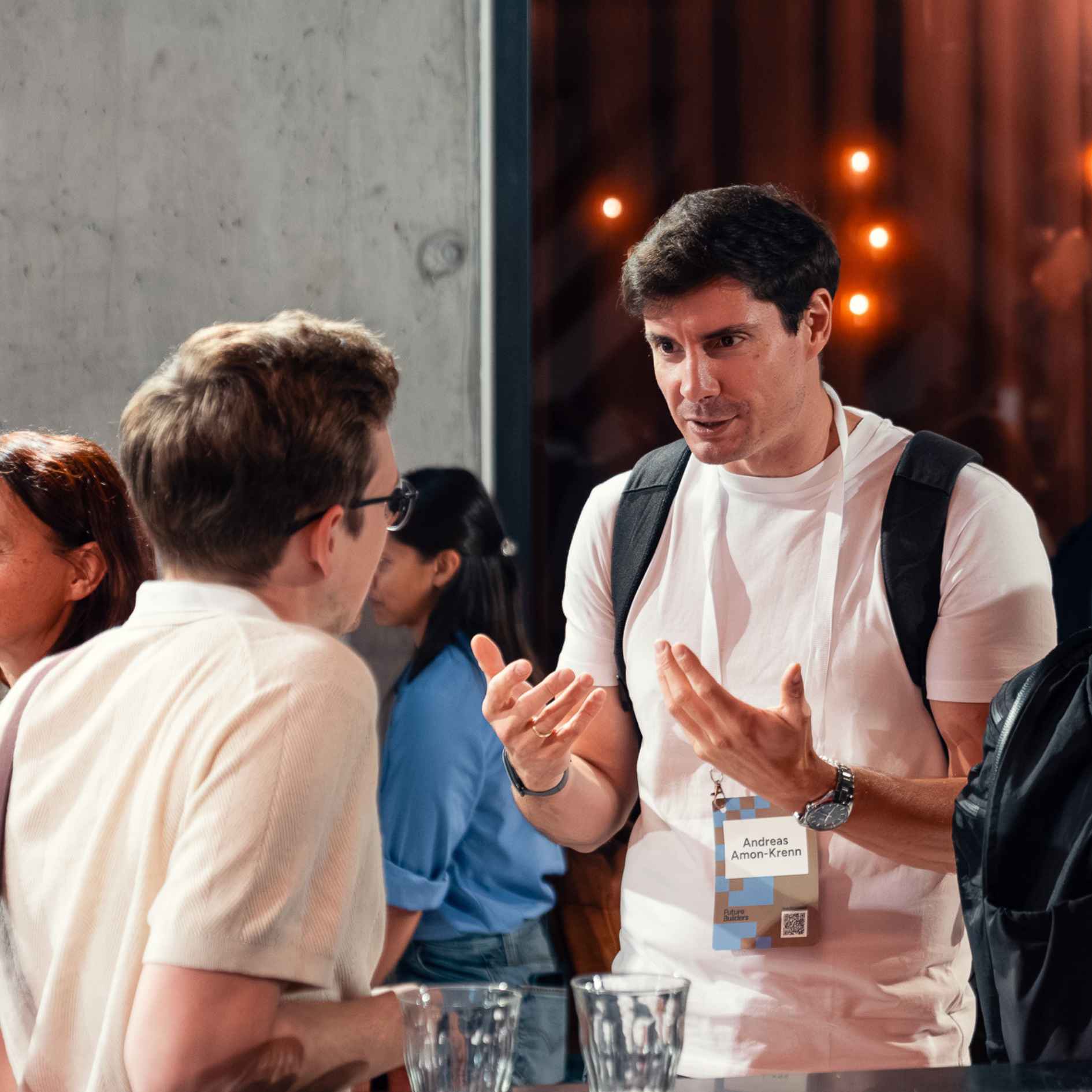 two attendees chatting in a break