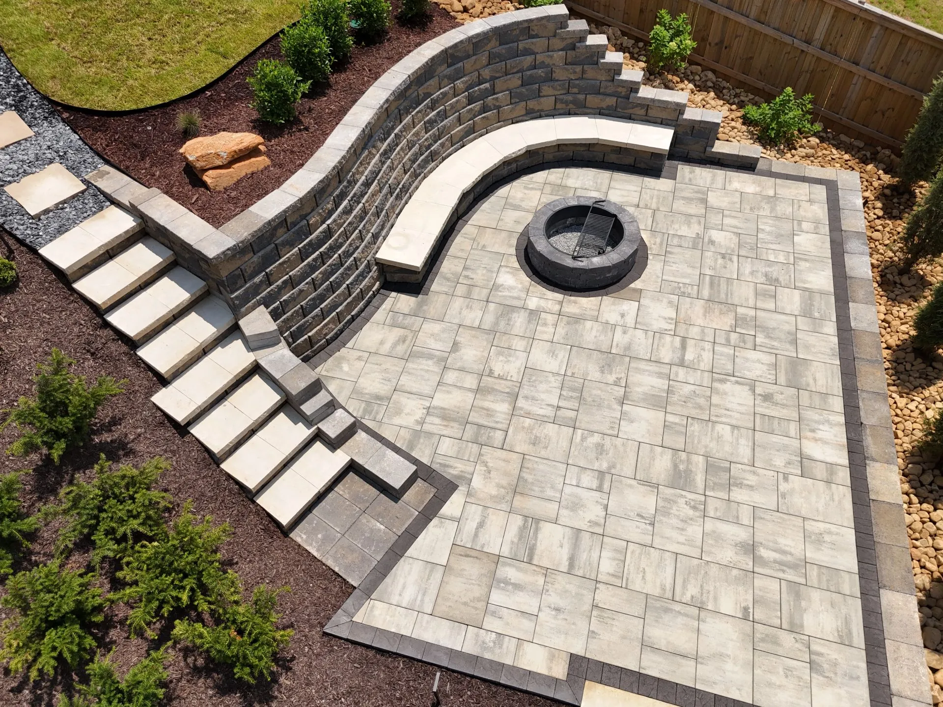 Landscape patio design with fire pit and retaining wall