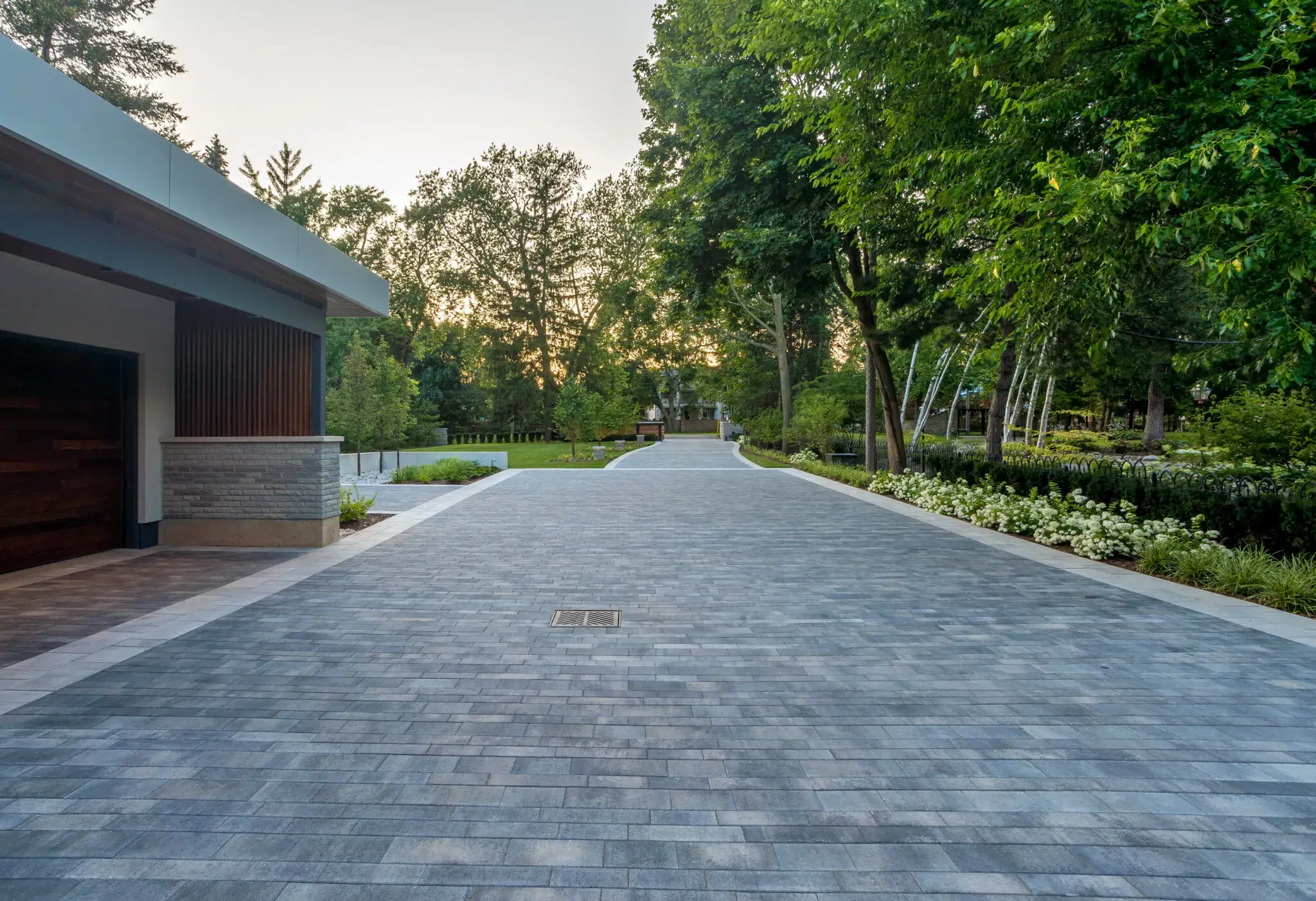 Landscape construction services for a paver driveway and gardens