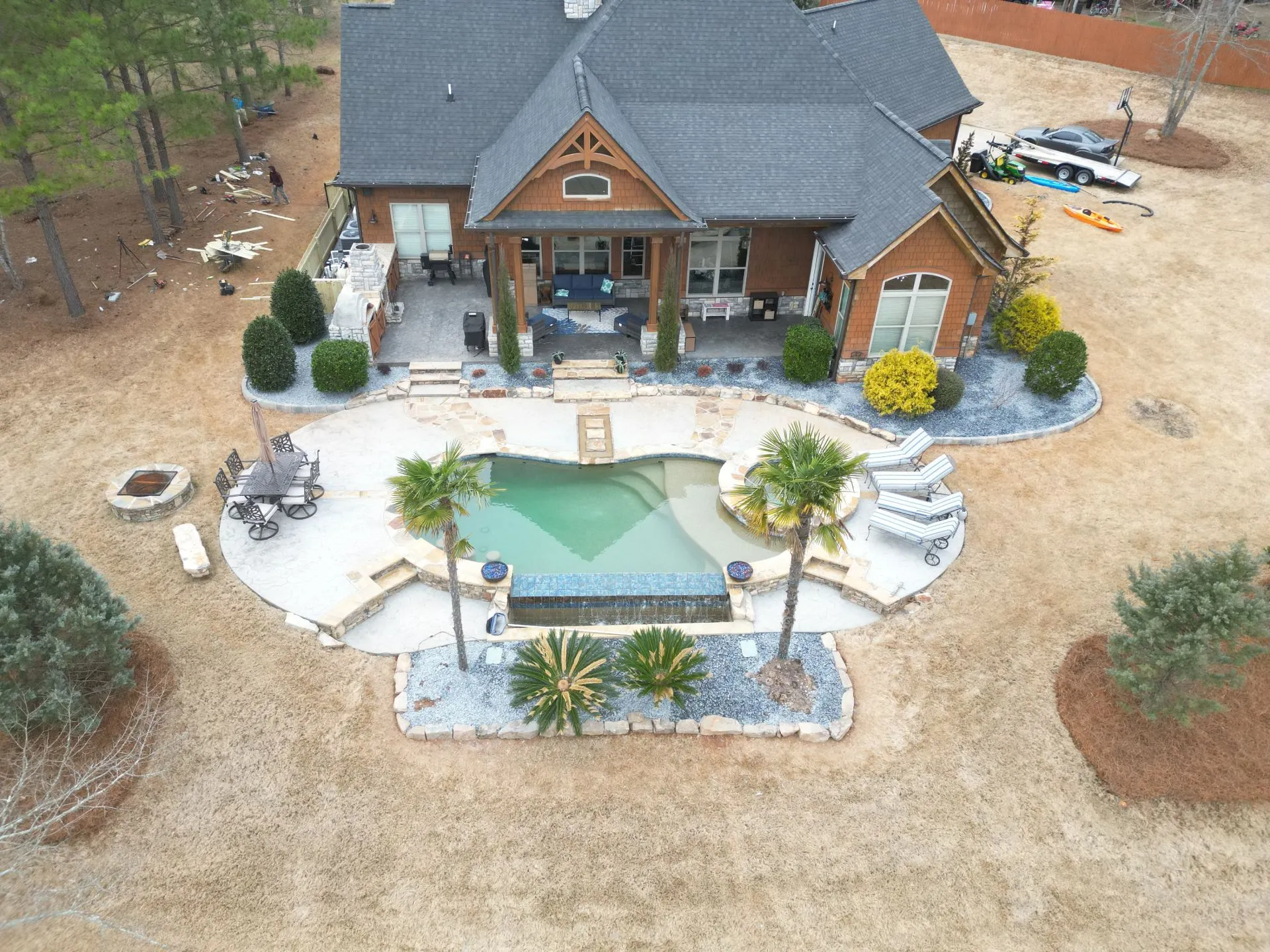 Outdoor patio builders creating a backyard poolside retreat