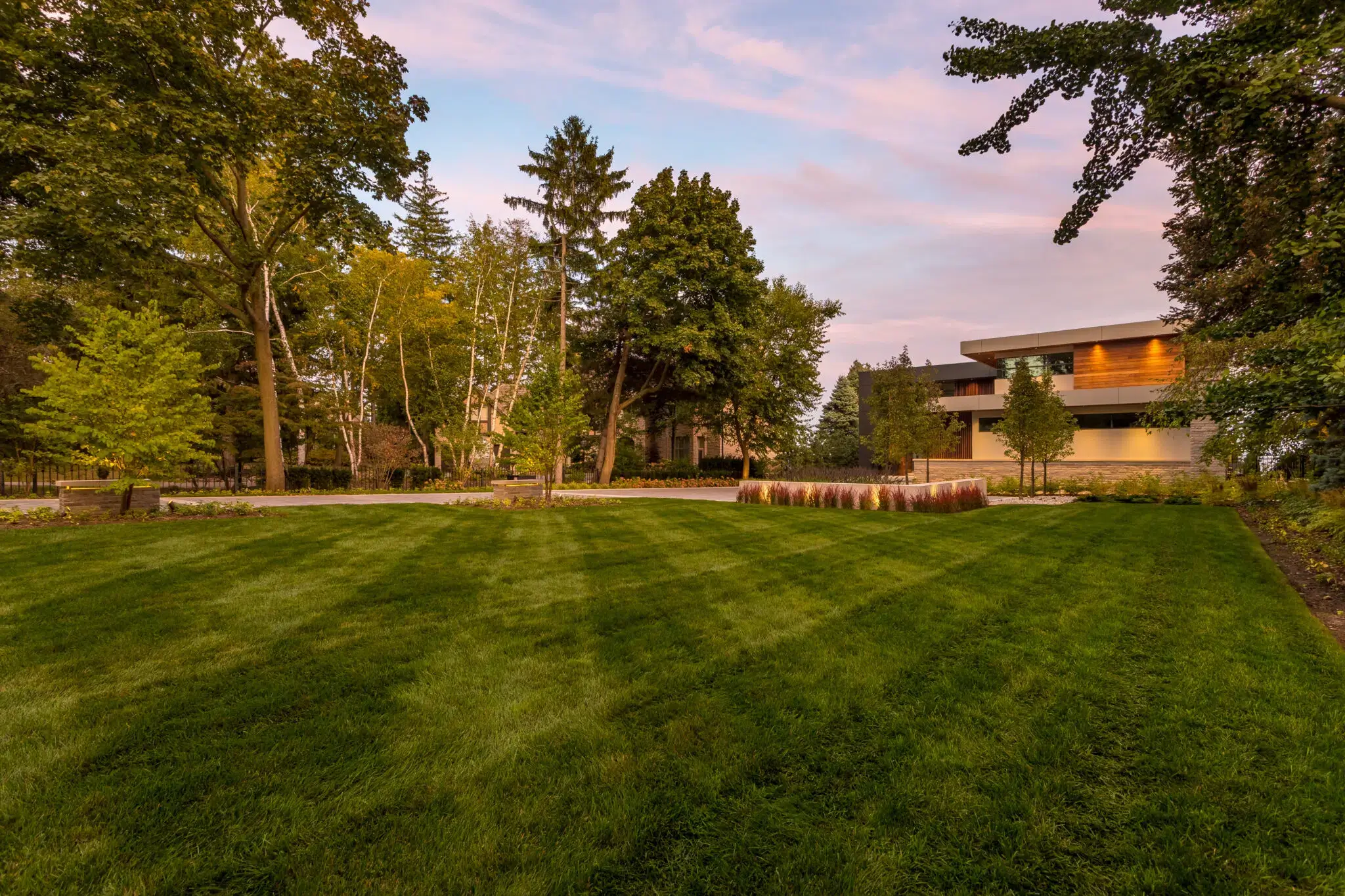 Residential landscape maintenance for a manicured lawn and trees