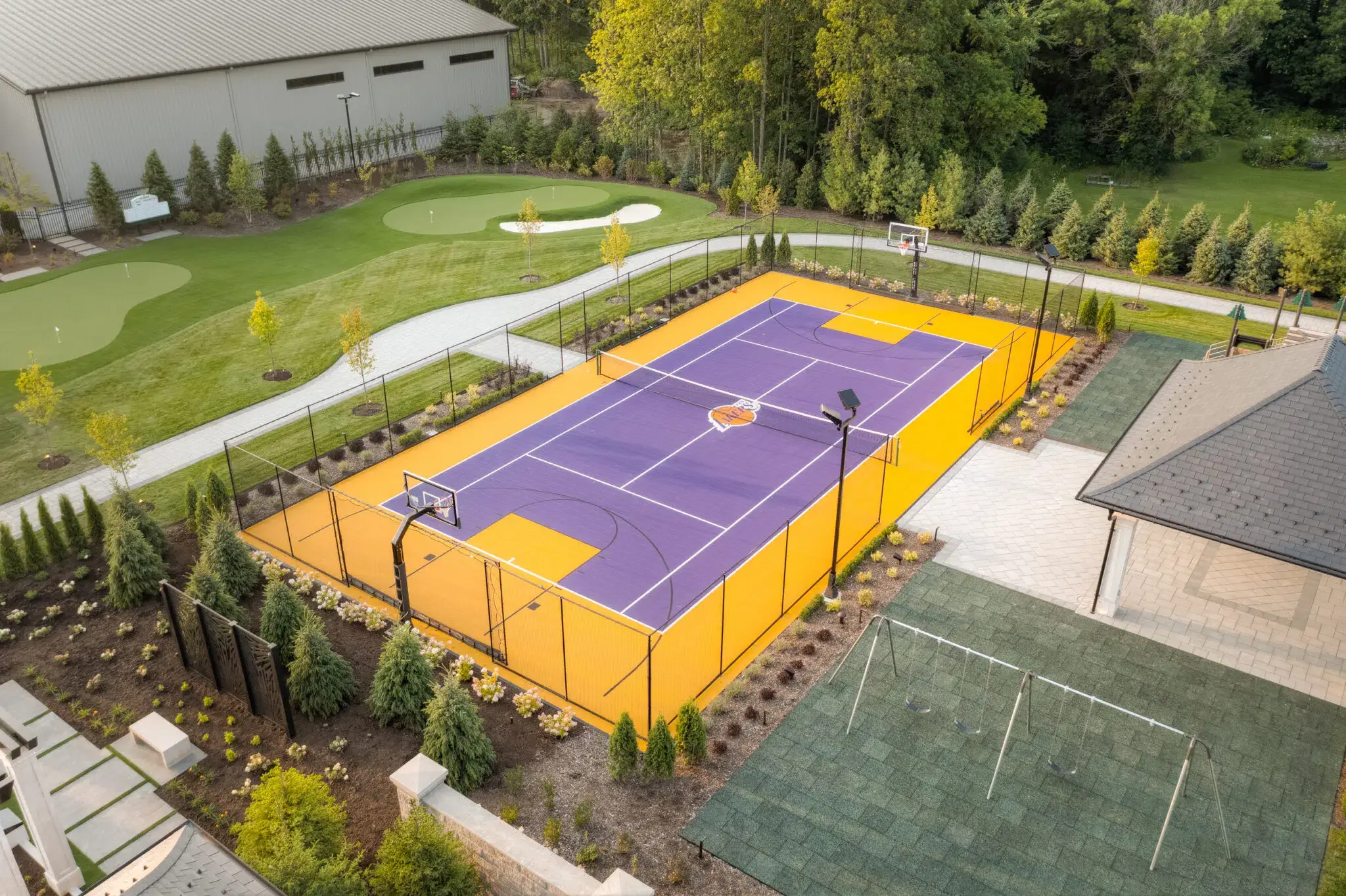 Commercial landscape installation surrounding a multipurpose sports court