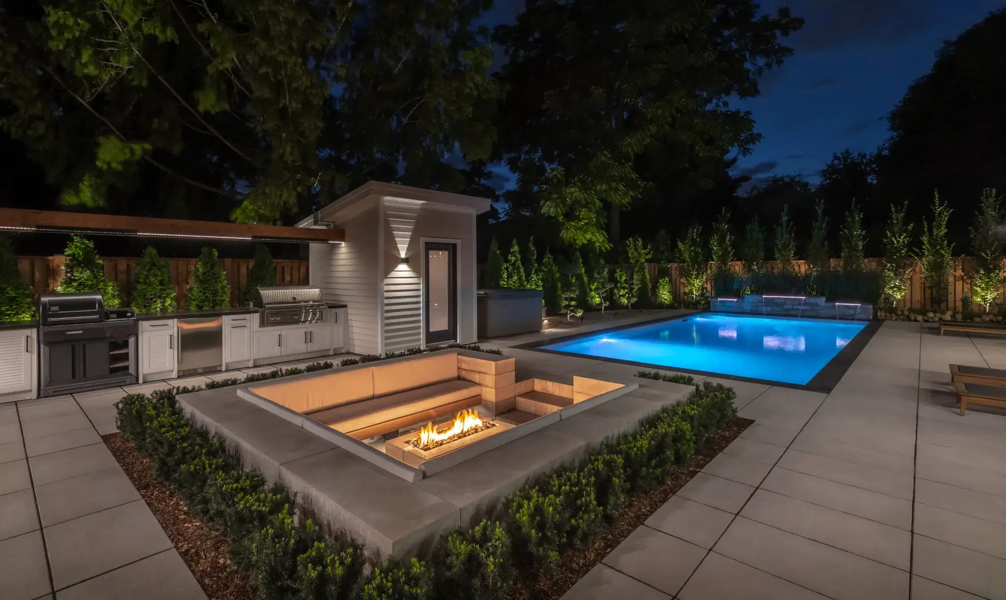 Outdoor Kitchen Landscaping With Sunken Fire Pit And Pool