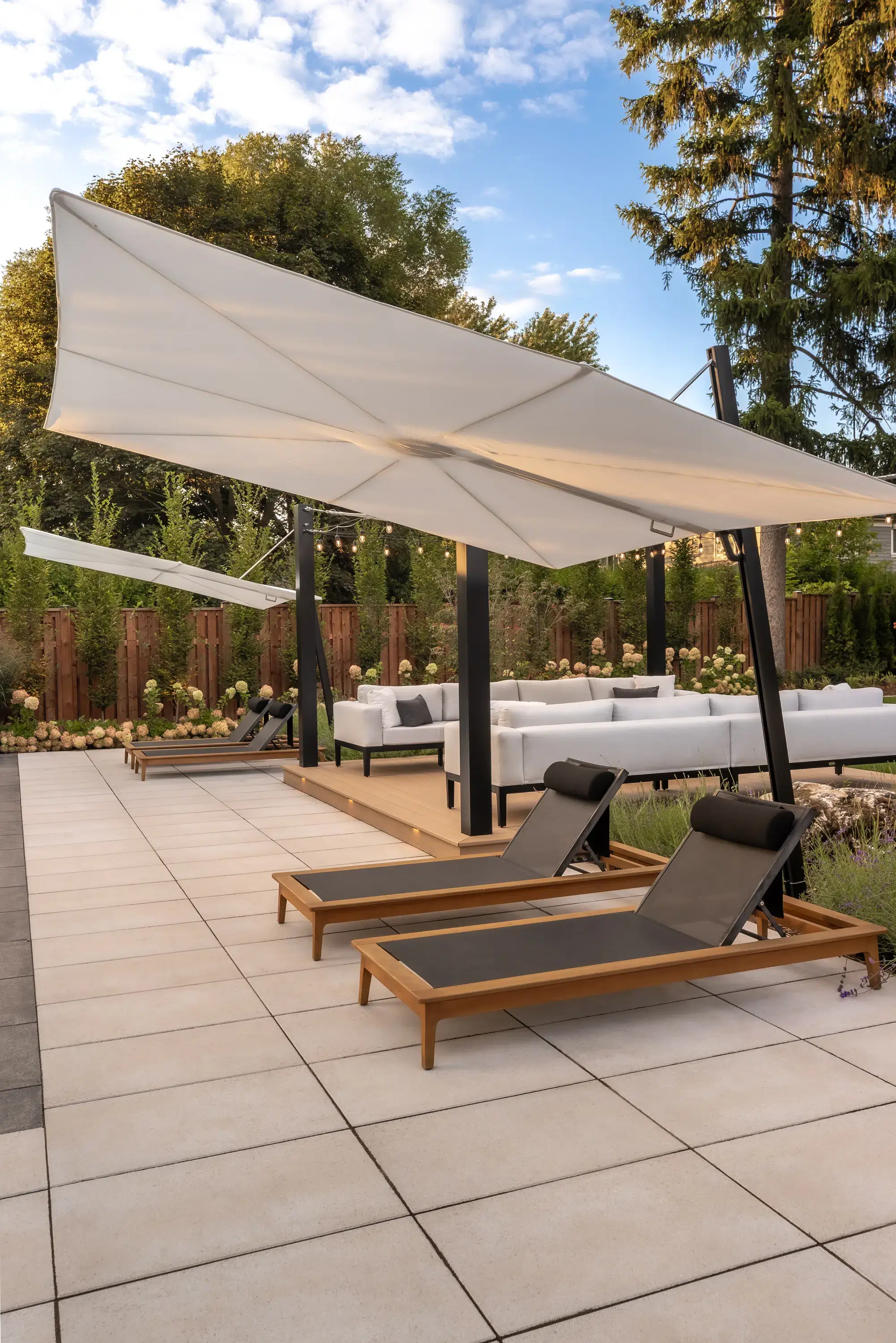 Custom outdoor living space design with shaded backyard patio
