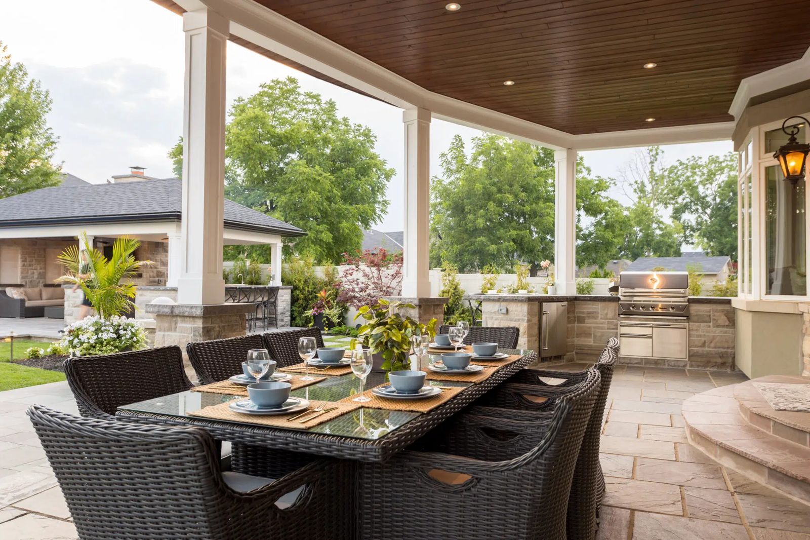 Outdoor kitchen landscaping With Covered Patio Dining Area