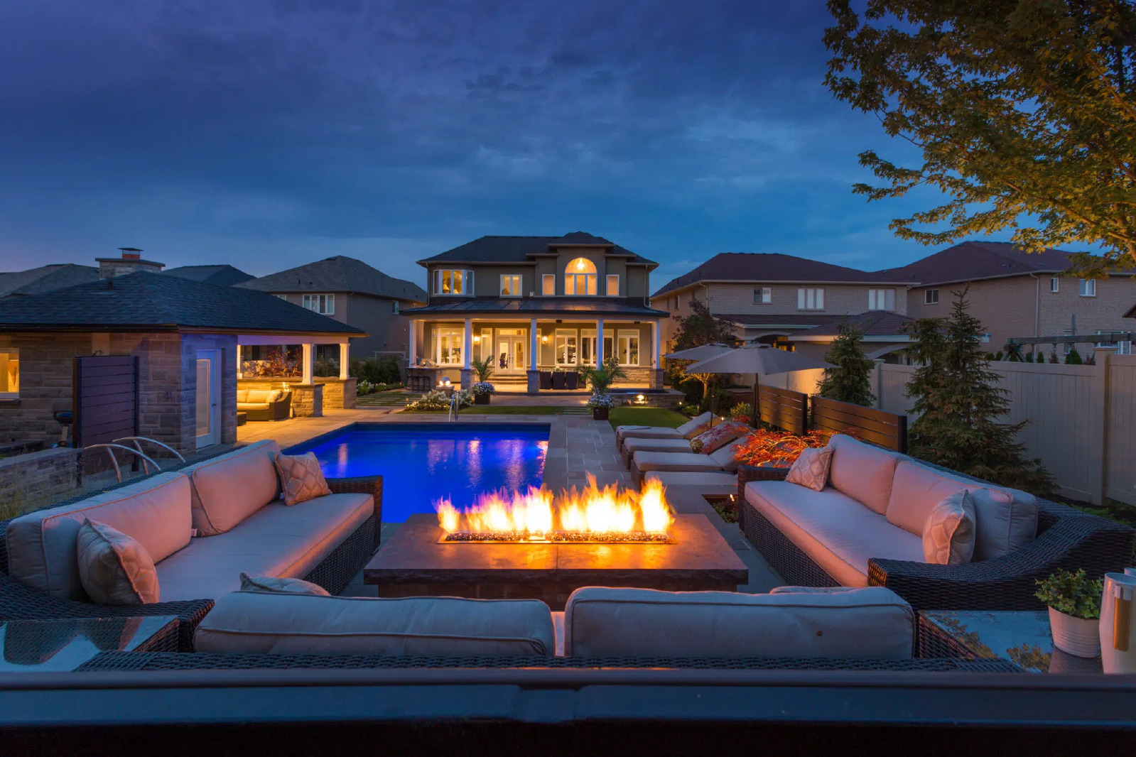 Fire Pit Installers Creating Poolside Seating Area