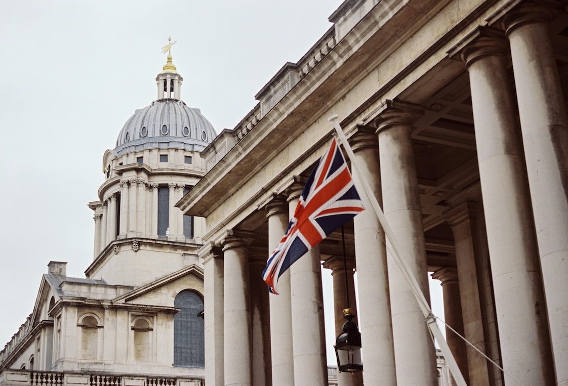 A classical colonnade with a Union flag, for the UK's second tranche of draft CBAM legislation