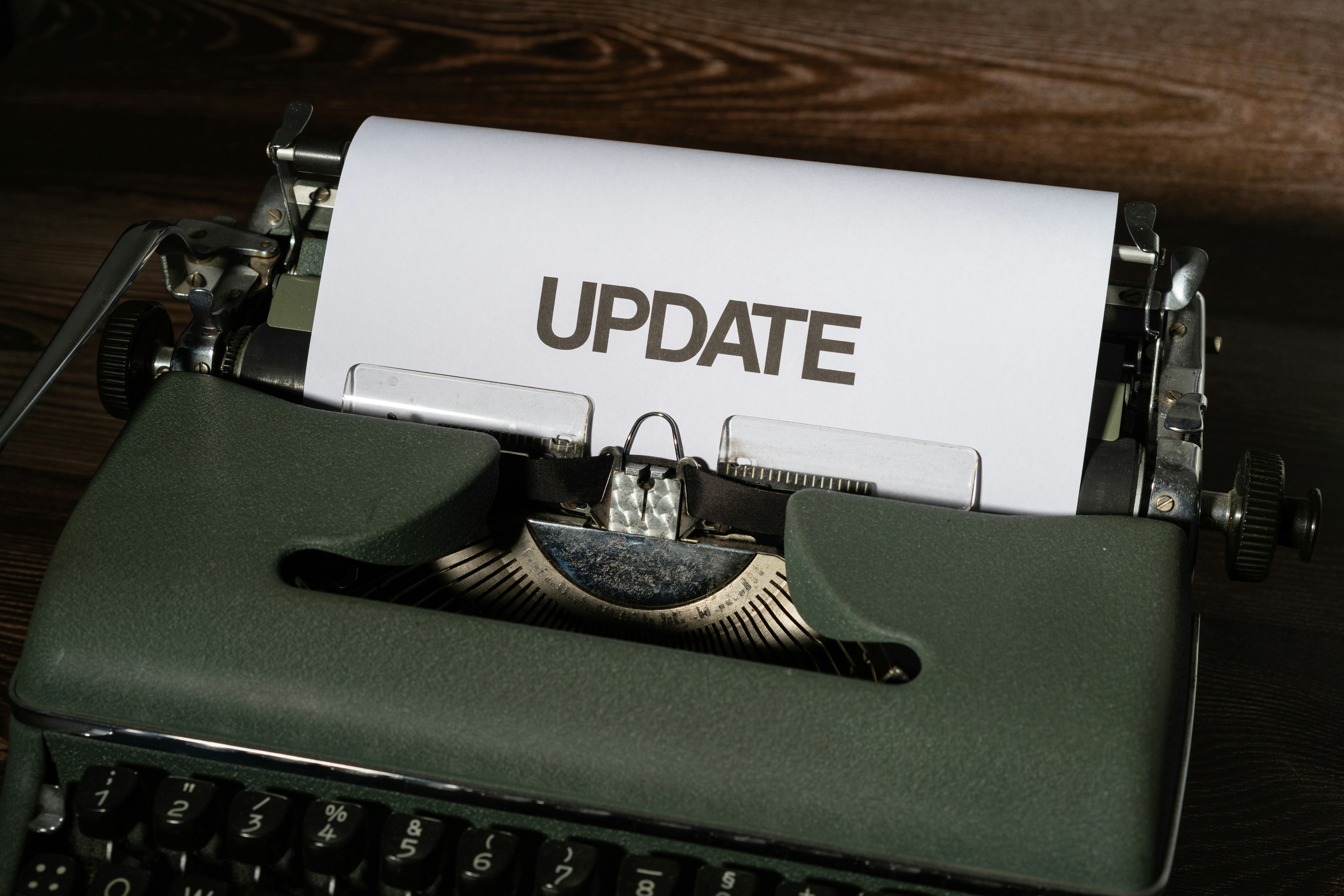 A typewriter with a page reading Update, marking the end of the CBAM transitional period