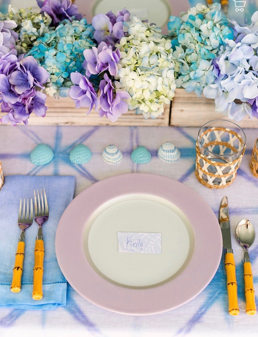 Hand painted shells with fresh flowers for a table setting