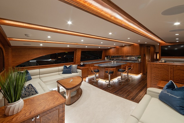 An image of the interior of the boat showing tables and chairs.