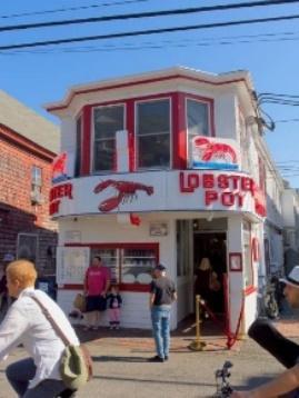 People gathered around the world famous Lobster Pot restaurant in Provincetown, Cape Cod.