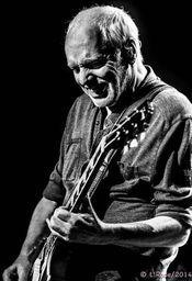 Peter Frampton playing a guitar