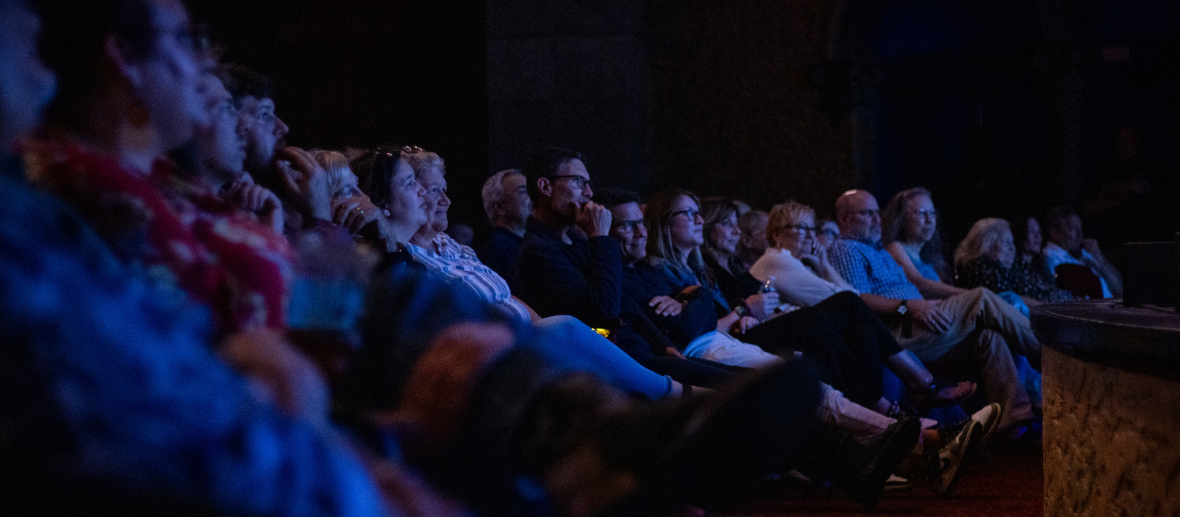 A group of people sitting in a row