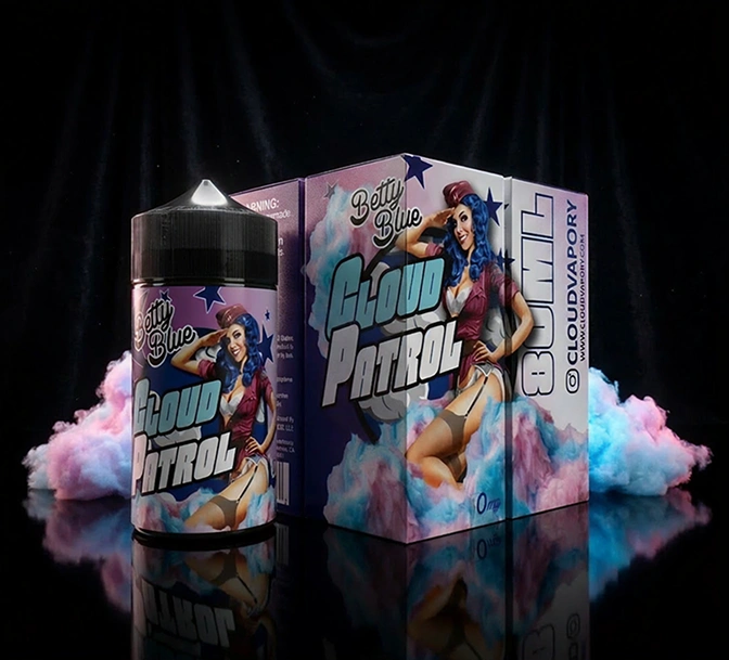 Cloud Patrol Betty Blue vaping liquid bottle and box with a retro woman in red outfit and blue hair surrounded by pink and blue smoke.