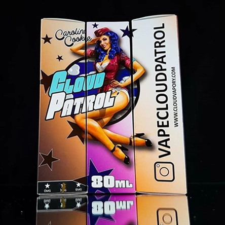 Packaging for Cloud Patrol vape liquid featuring a pin-up style woman with blue hair, text indicating 80ml volume, and VAPE CLOUD PATROL brand with website.