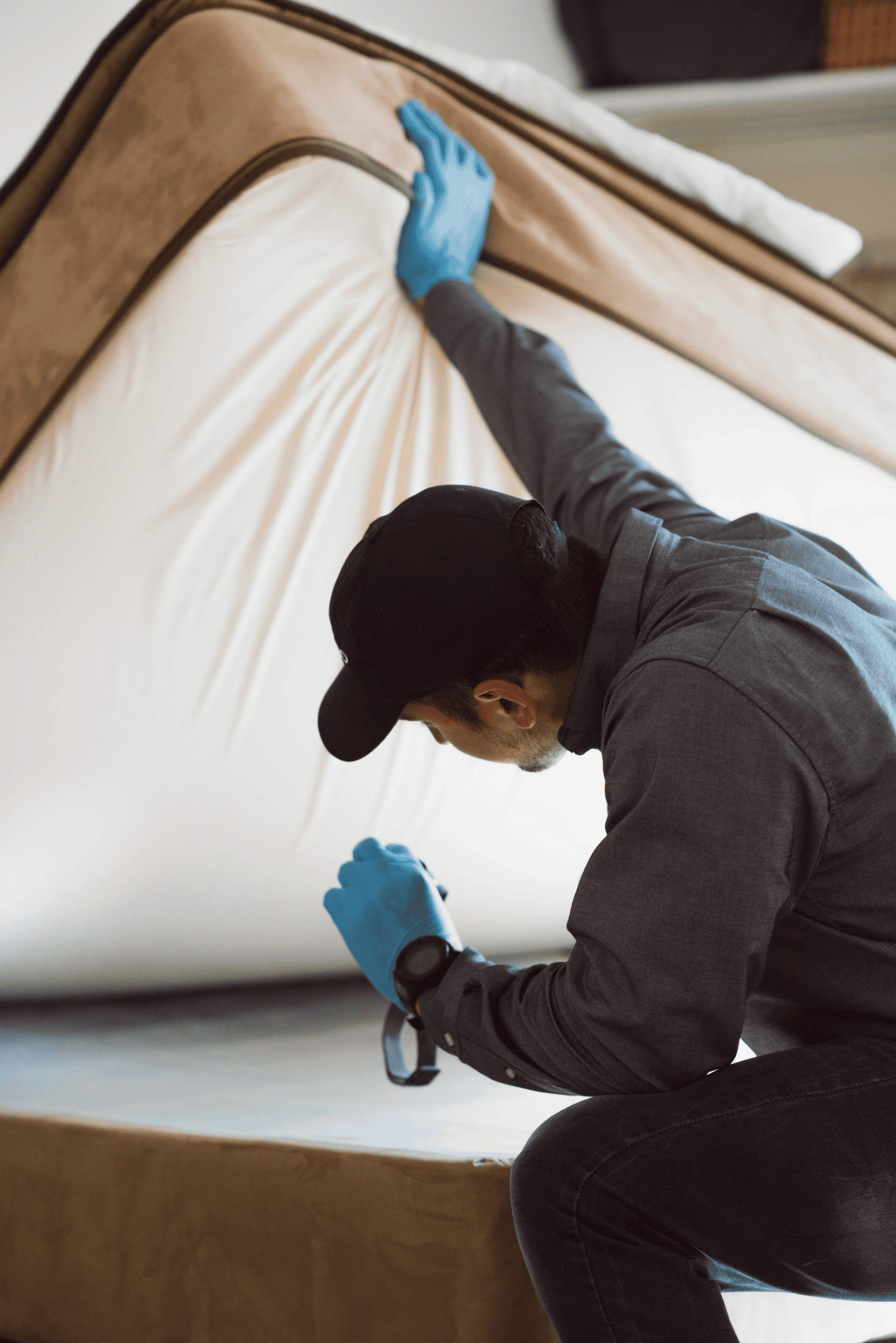 person doing bed bug inspection