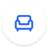 Blue armchair icon inside a white circle on a transparent background.