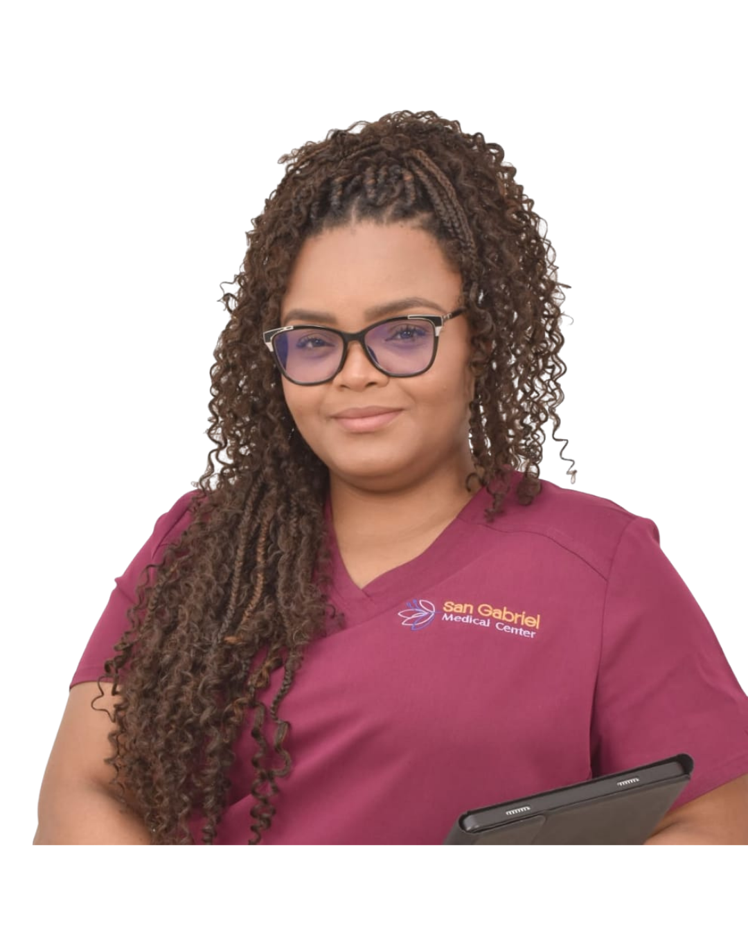 Woman with long curly hair and glasses wearing a maroon San Gabriel Medical Center scrub top holding a tablet.