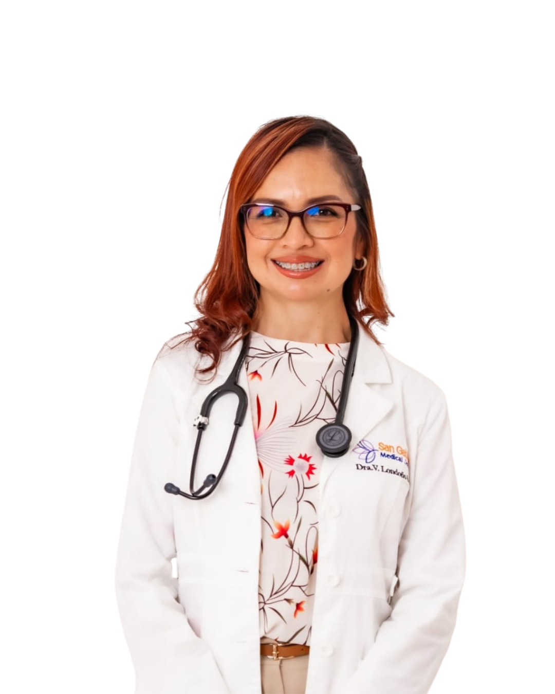 Female doctor with glasses and braces wearing a white coat and stethoscope, smiling.