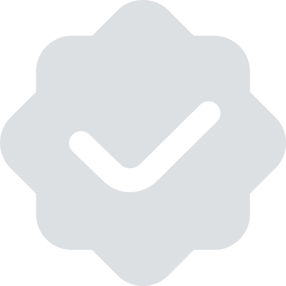 Gray badge-shaped icon featuring a black checkmark in the center.