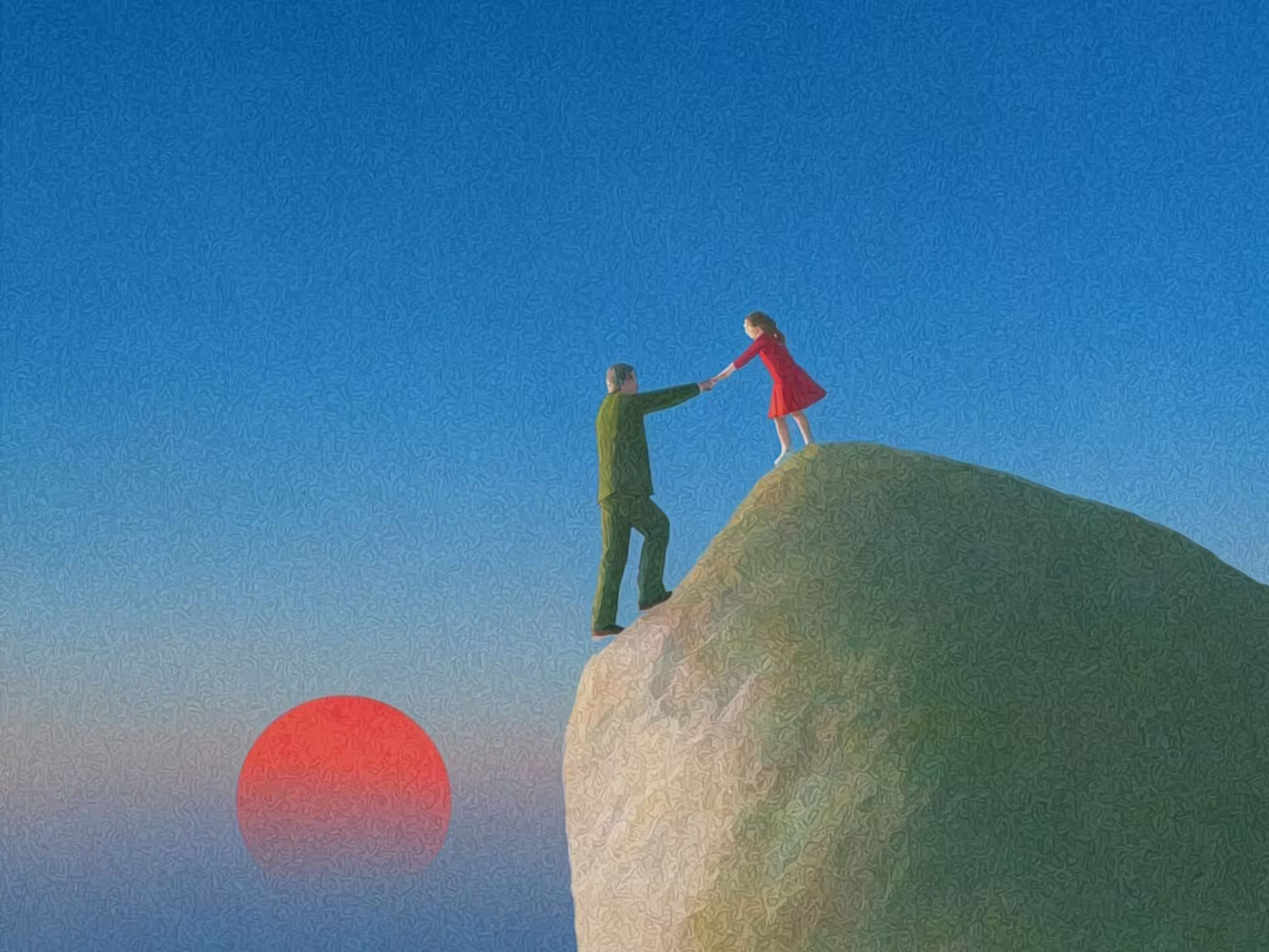 Man helps a girl in a red dress climb a large rock with a red sun setting in the background.