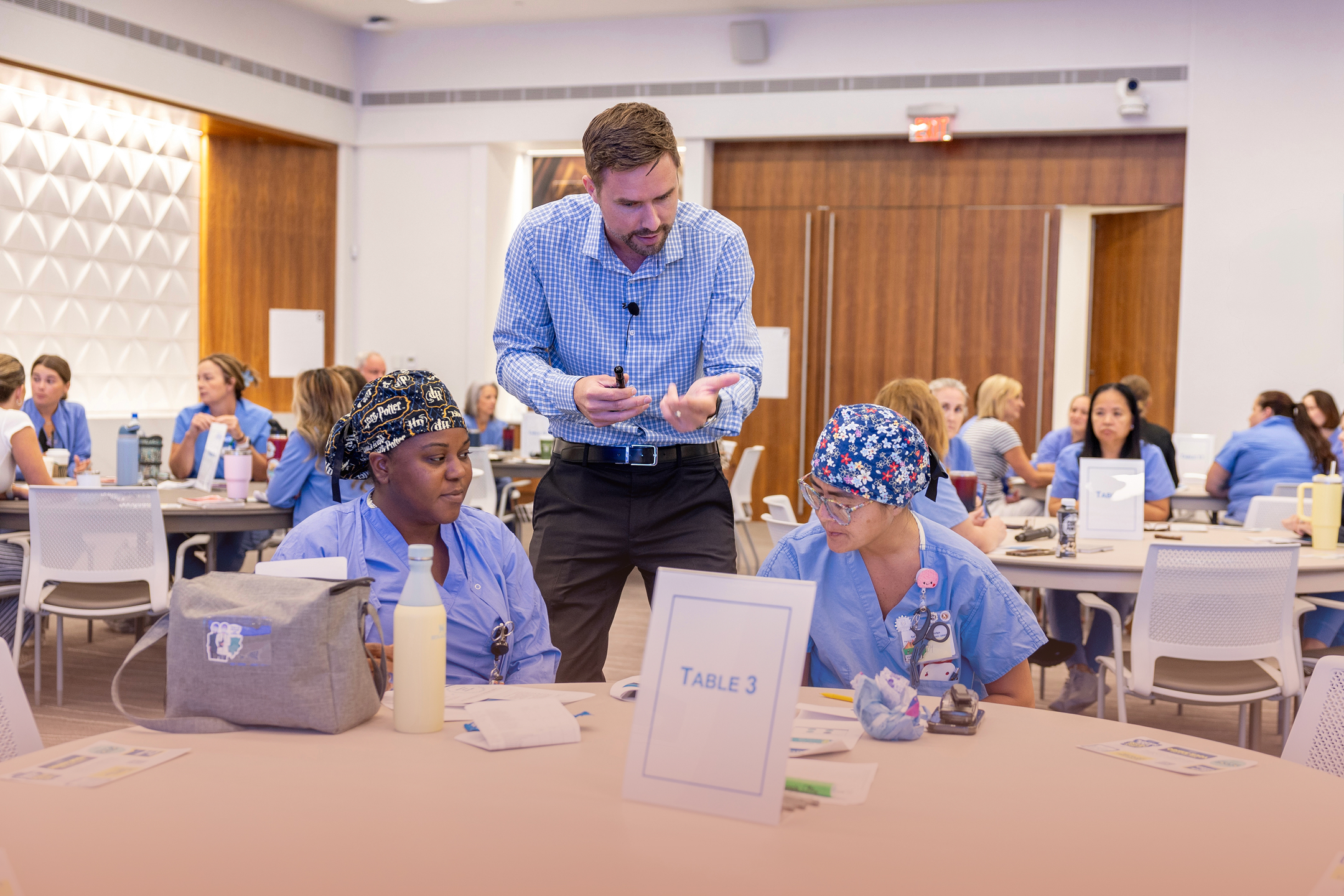 Alex Dorr leading a small-group leadership workshop with healthcare professionals