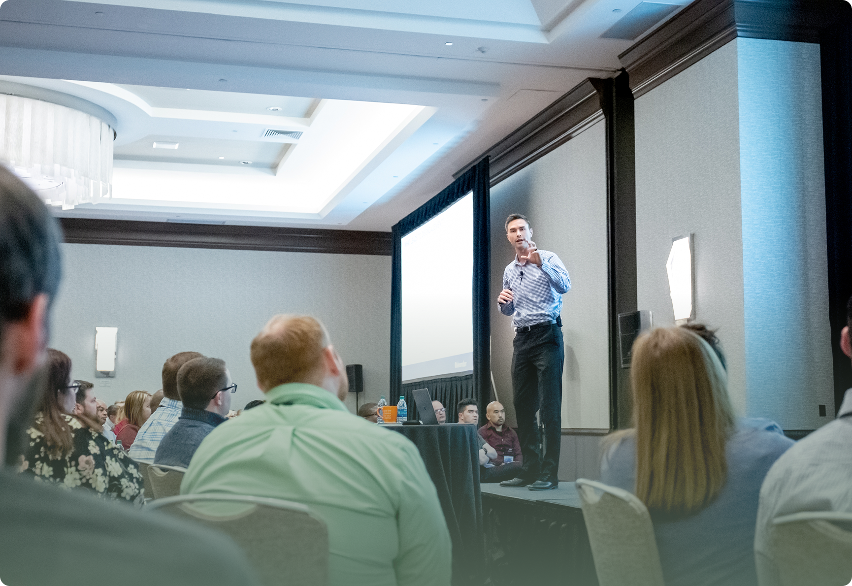 Alex Dorr speaking at The Summit leadership conference, helping leaders build accountability, improve culture, and reduce workplace drama