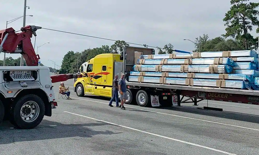 Elite Towing and Recovery crew transferring a shifted freight load in Gainesville, FL
