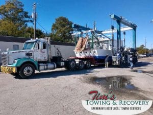 Heavy Duty Towing Service Moving A Boat From A Repair Shop