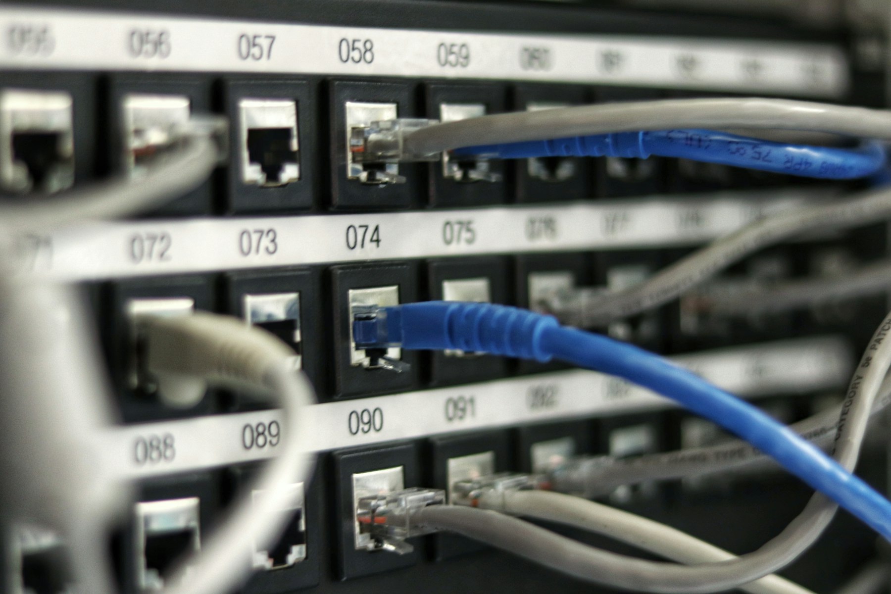Network patch panel with connected cables