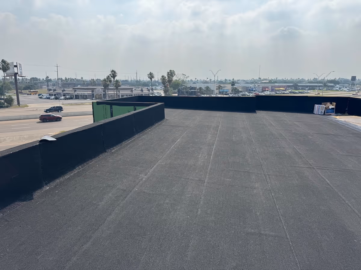 Completed commercial flat roof on retail building along an RGV highway