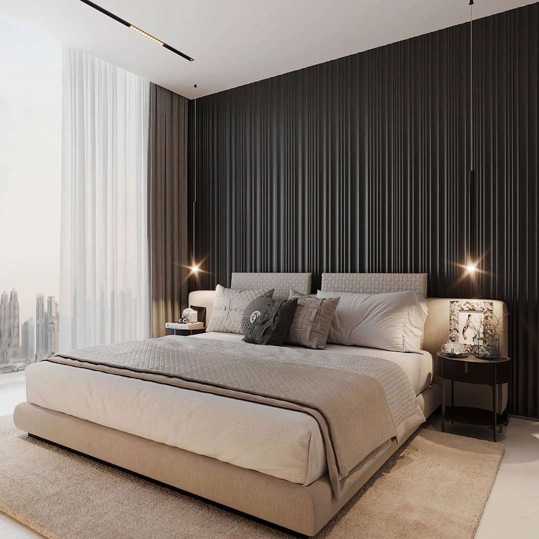 Modern bedroom with a large beige upholstered bed, textured pillows, soft beige bedding, dark vertical panel wall, hanging pendant lights, and a round bedside table with decorative items.