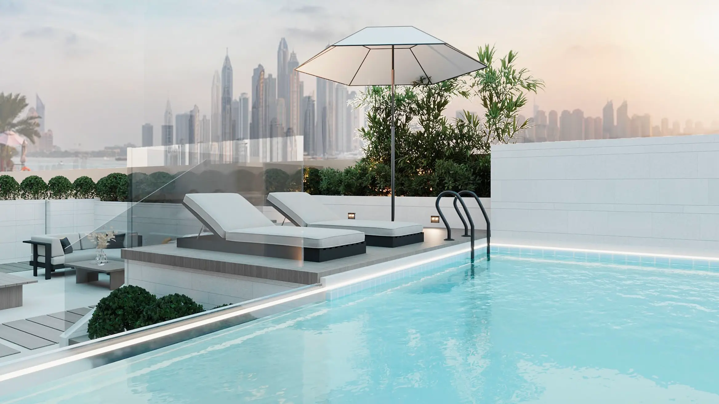 Modern rooftop pool with clear water, two lounge chairs under a large white umbrella, surrounded by plants, with a city skyline in the background.