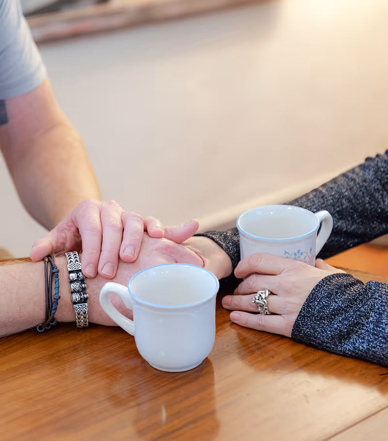 doug and lindsey's hands holding coffee 1