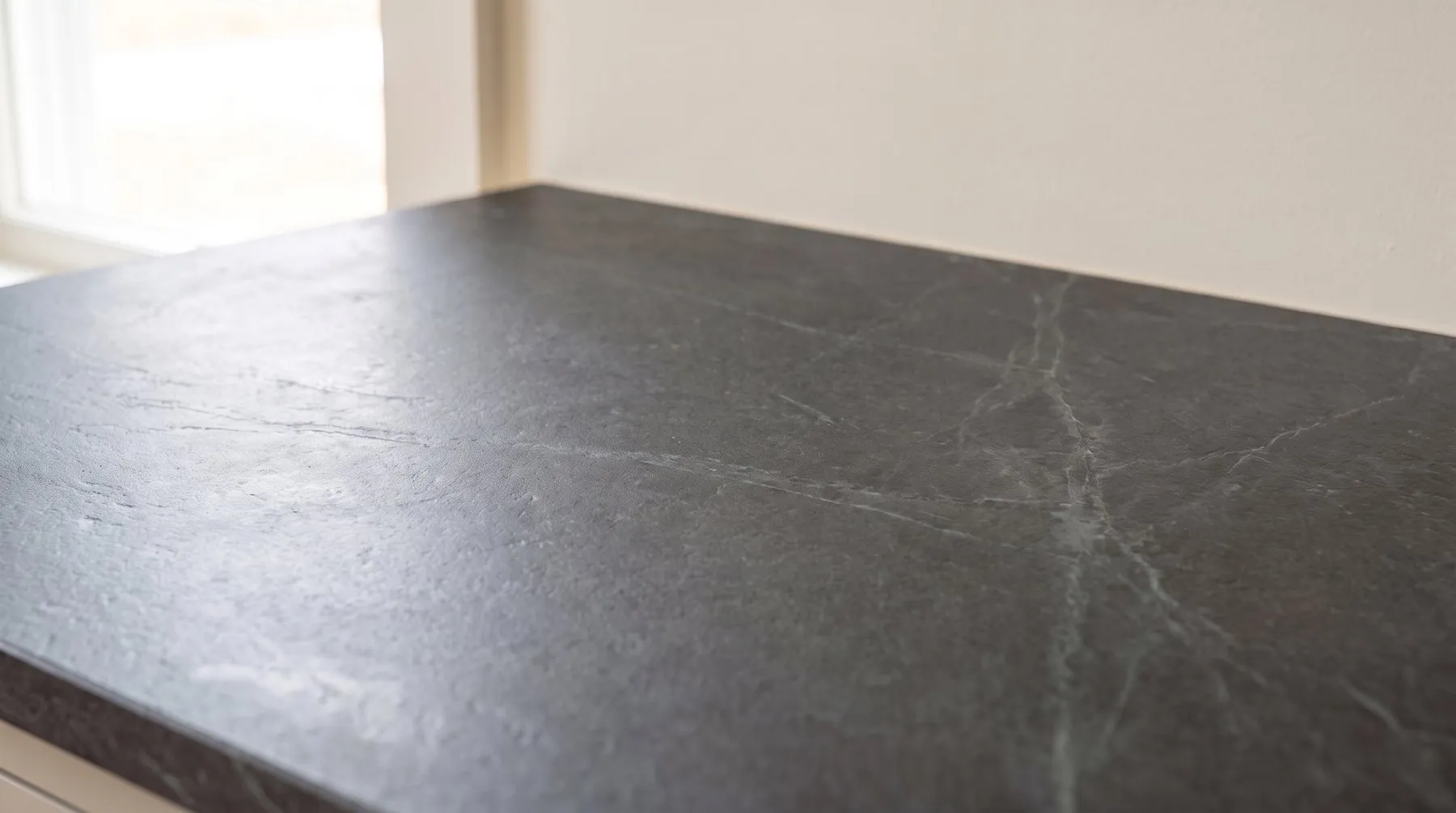 Honed charcoal countertop with a soft matte surface and no glare