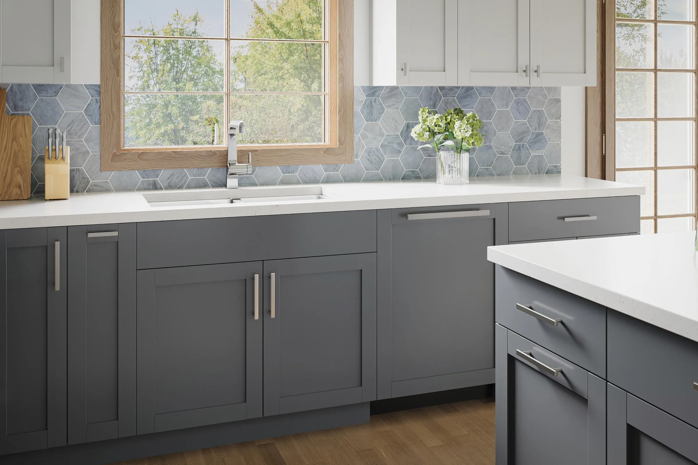 Atlas Homewares brushed bar pulls on gray shaker cabinets under a white countertop