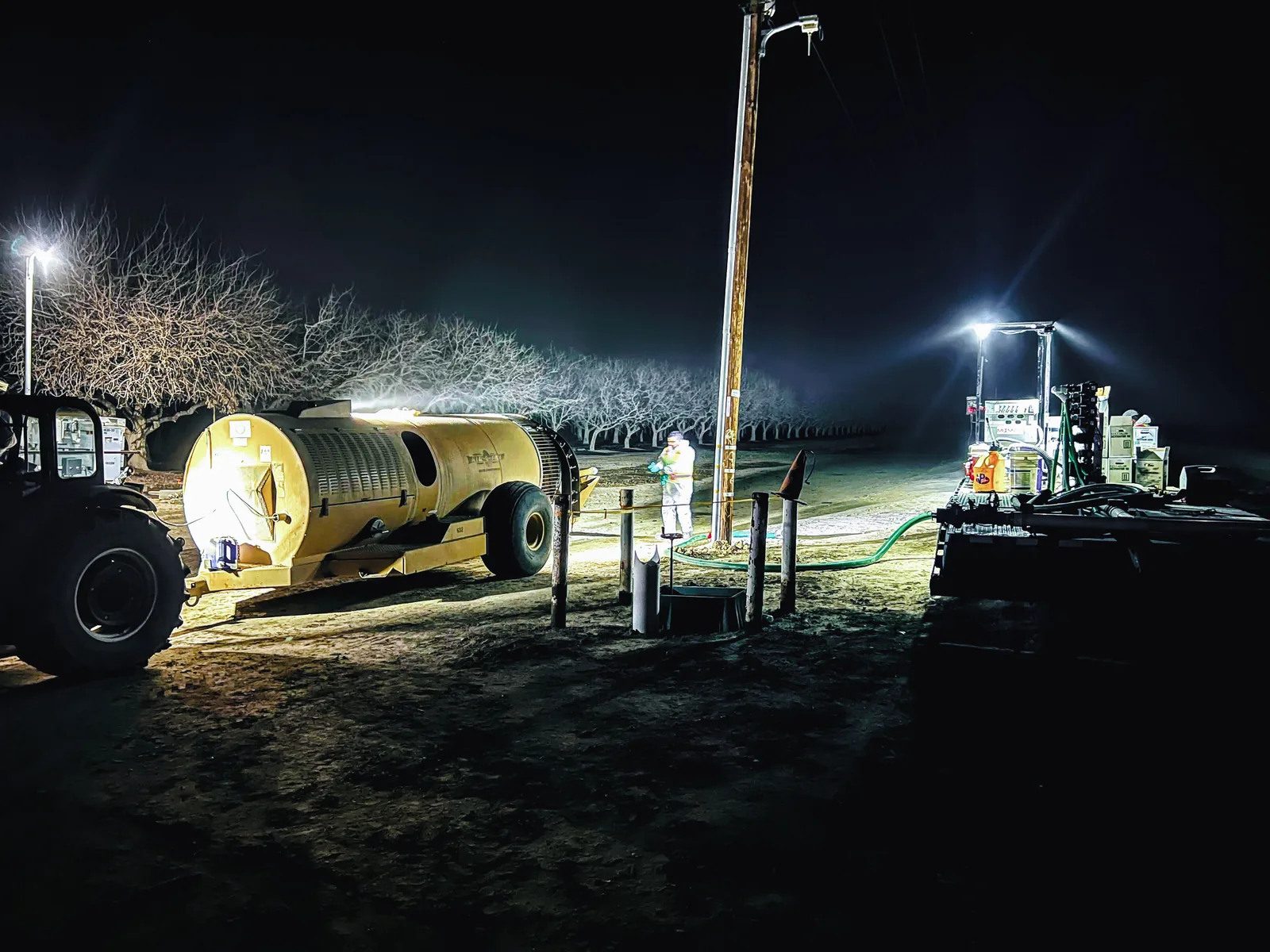 Night loading in the orchard: Pro Inductor tender under work lights