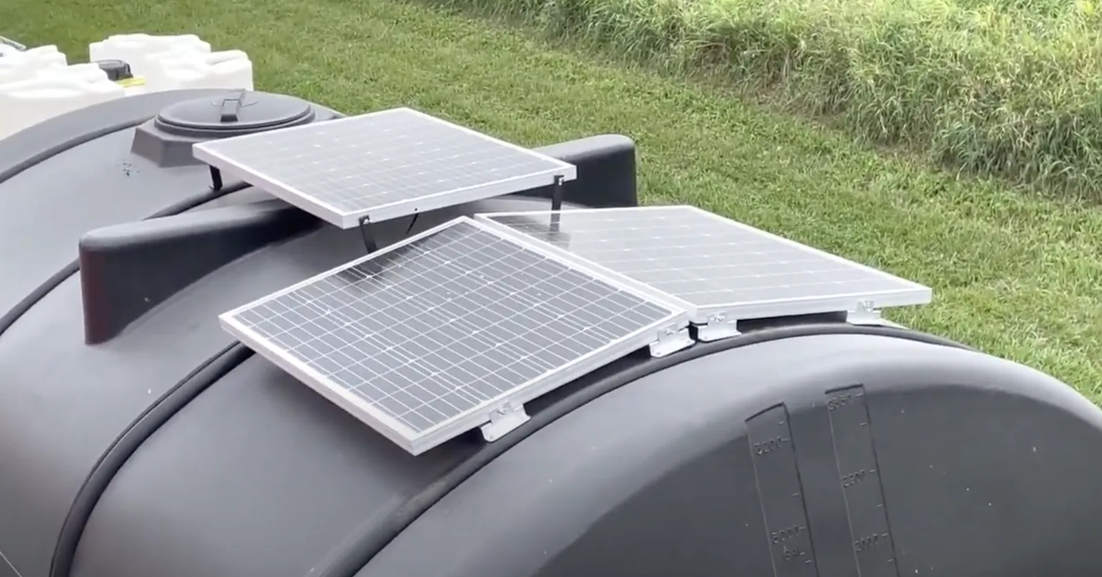Solar panels on the water tank keep the system charged in the field