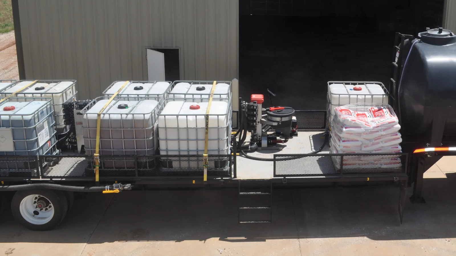 Tote trailer with Fusion Inductor, dry product pallet, and rear water tank
