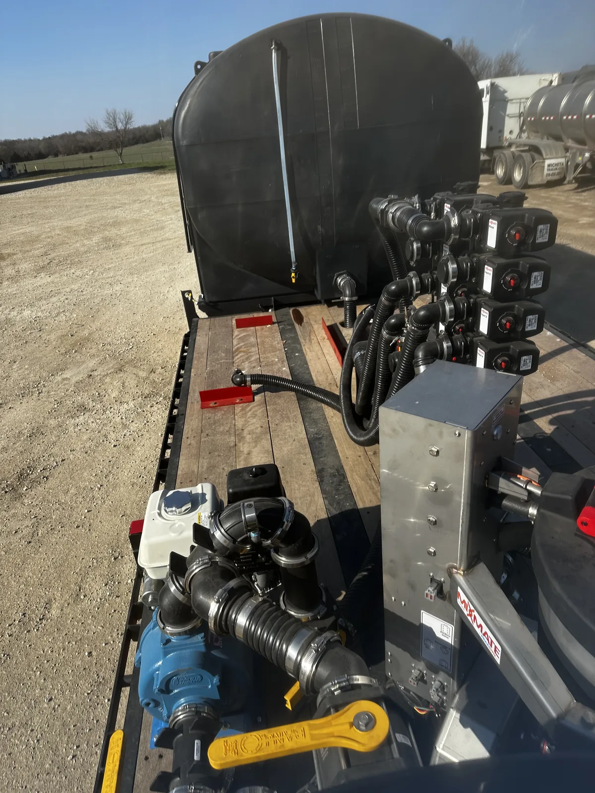 Stack, pump, and 3-inch valves on a flatbed tender