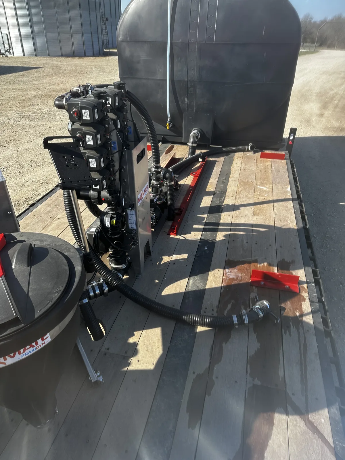 Four-input stack on a flatbed, plumbed to the rear water tank